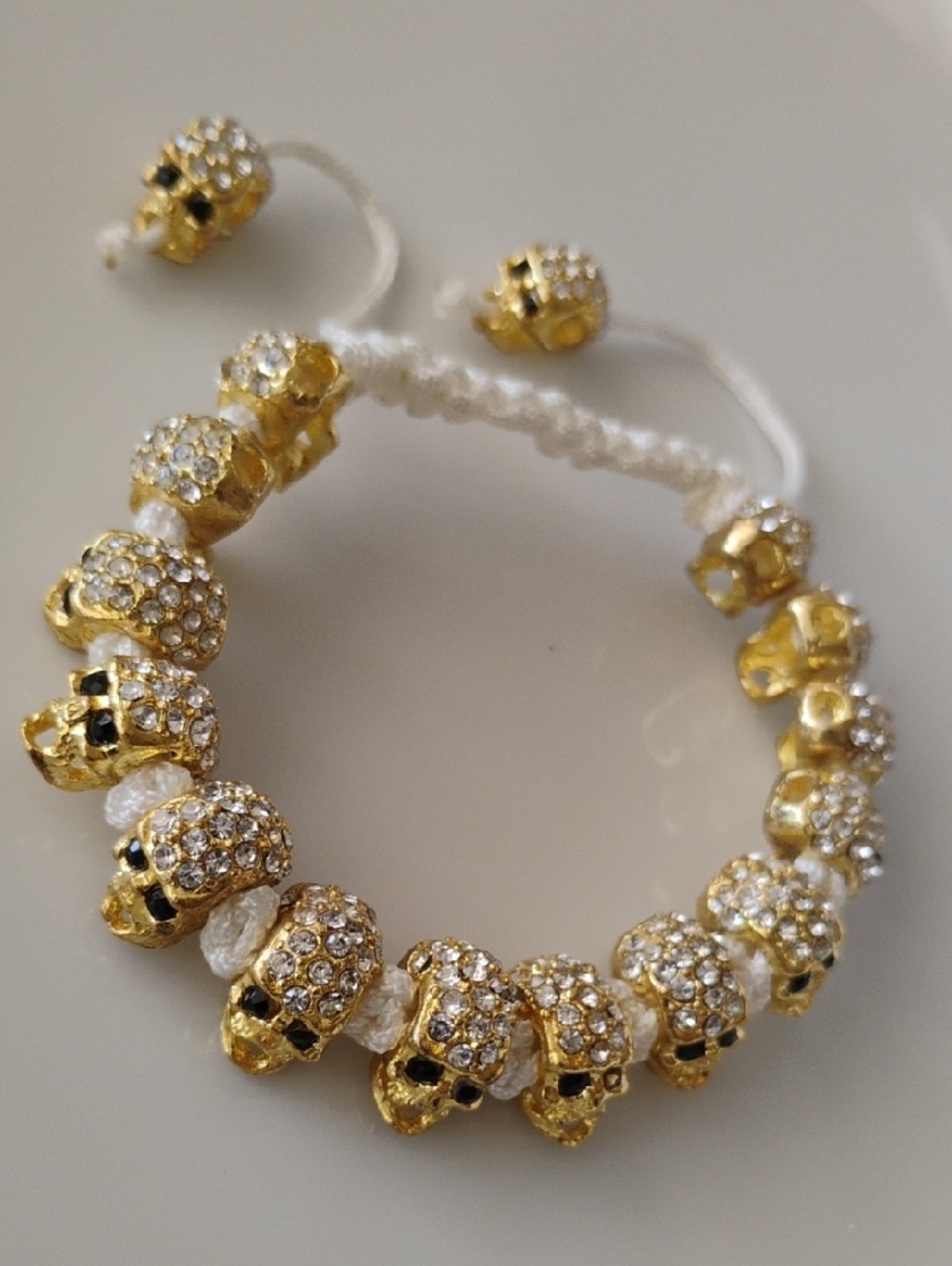 Gold tonel Skull Beaded Macramé Bracelet with decorative rhinestones